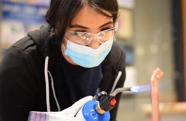 Truman High School AJAC apprentice making copper pipe