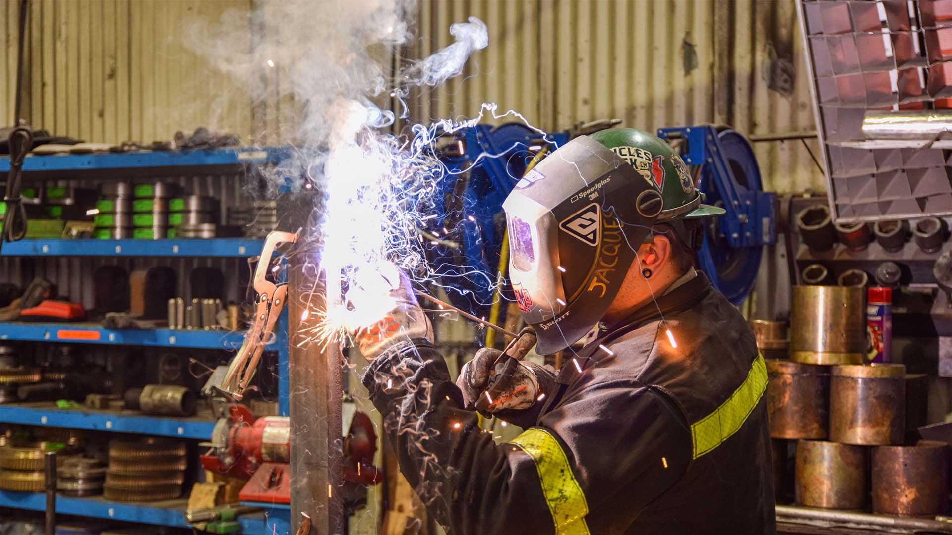 Industrial Maintenance Technician welds during on-the-job training