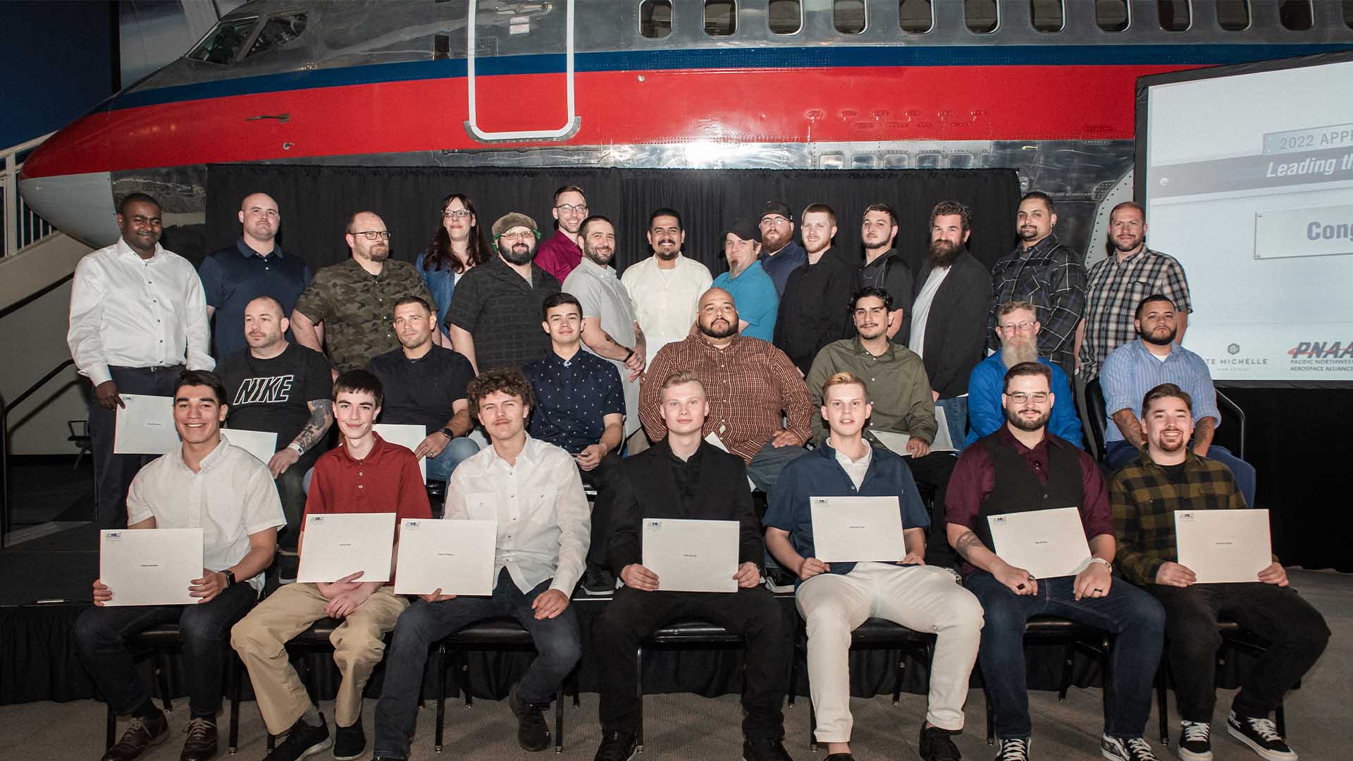 AJAC graduates take their group photo at The Museum of Flight after earning their journey-level card