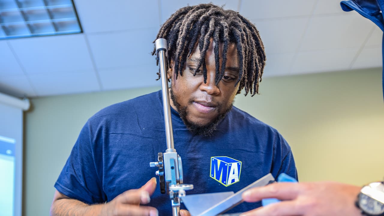 A Manufacturing Academy student uses a height gauge during class at Green River College