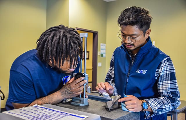 Students learn precision measuring during AJAC training