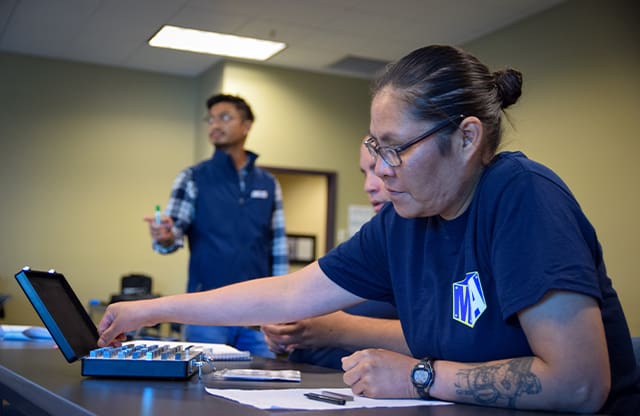 Students learn technical drawings during class