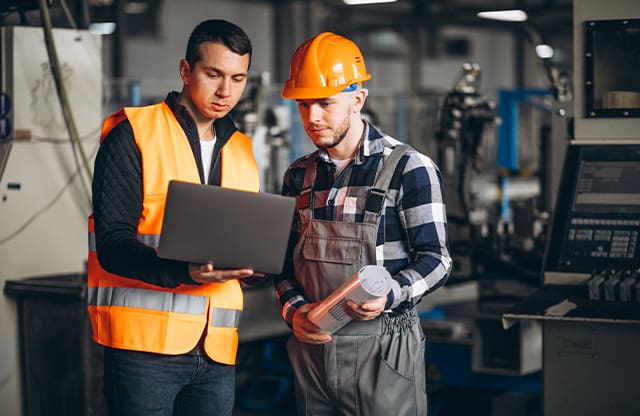 Logistics specialist discusses plan with supervisor