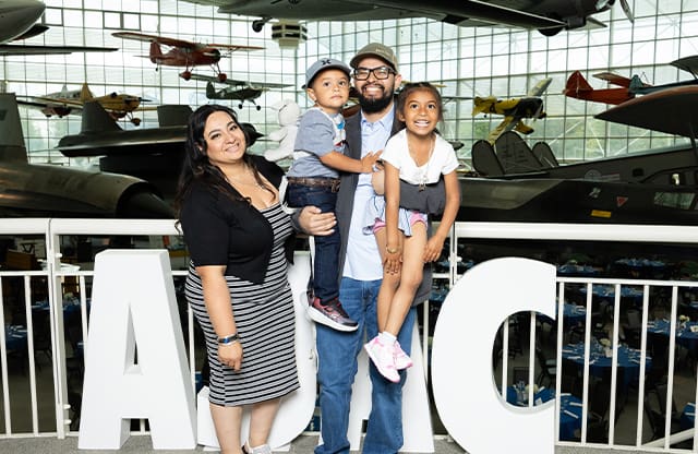 Families celebrate at AJAC's 2024 graduation ceremony.